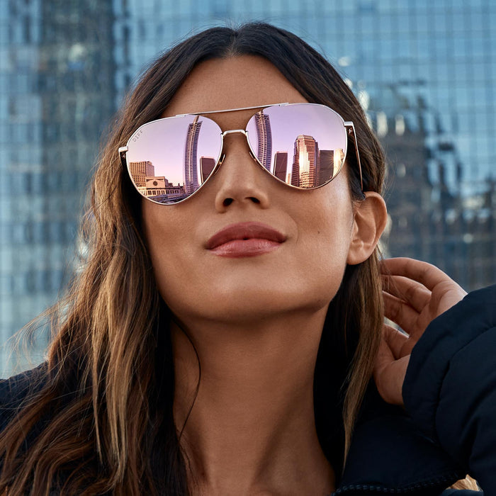 lifestyle - brunette wearing dash rose gold cherry blossom sunglasses