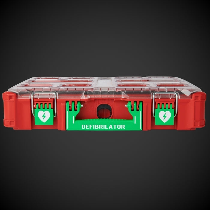 Red and green defibrillator label on a black background