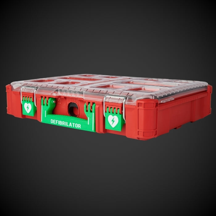 Red and green defibrillator case on a dark background