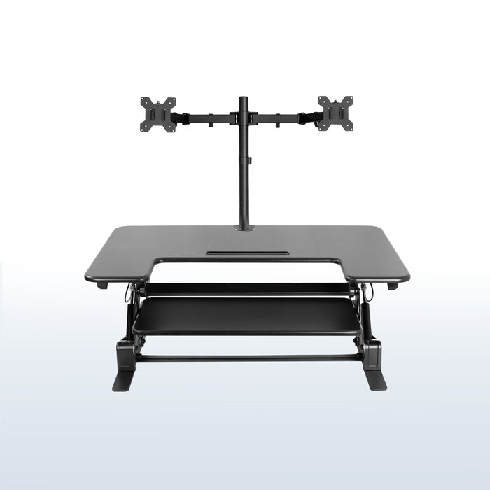 Height adjustable desk riser with articulating dual monitor mount.
