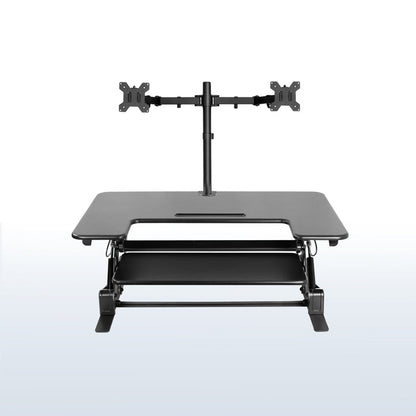 Height adjustable desk riser with articulating dual monitor mount.