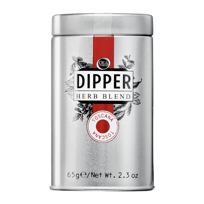 A tin container of Dipper Herb Blend with a label indicating 'Toscana' and a net weight of 65g/2.3 oz.