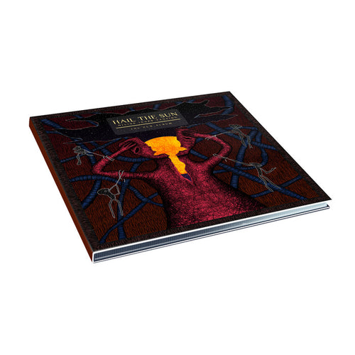 A hardcover book from Hail The Sun features a tree with dark branches, a glowing orange-red center, and the title Hail The Sun on top—mirroring their Divine Inner Tension album (digital download released August 2023) on a plain white background.