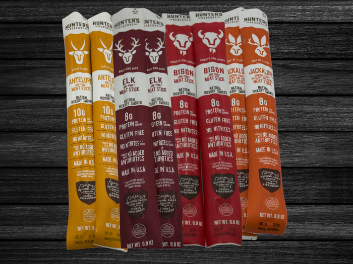 Exotic meat sticks bag featuring 14 unique wild beef jerky snacks, including antelope, elk, bison, and jackalope flavors, perfect gift idea.