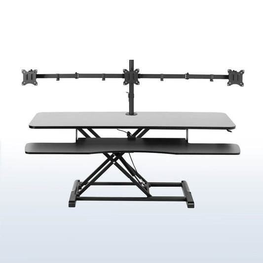 Spacious height adjustable desk riser with articulating triple monitor mount.