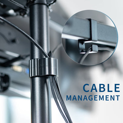 Spacious height adjustable desk riser with articulating triple monitor mount.