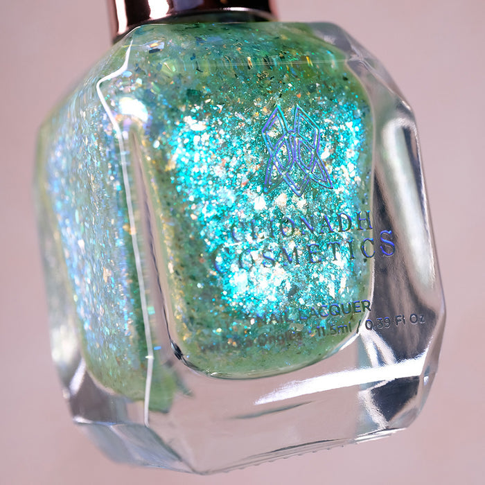 Close-up, angled shot of Fauxjito Nail Lacquer bottle on a beige background.