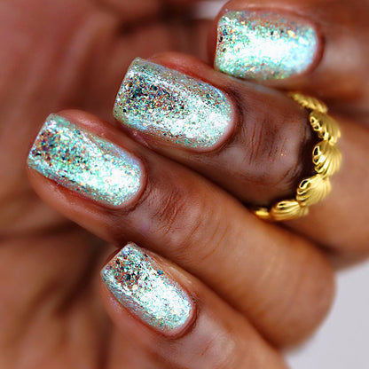 Close-up of nails painted with Fauxjito Nail Lacquer on deep skin tone.