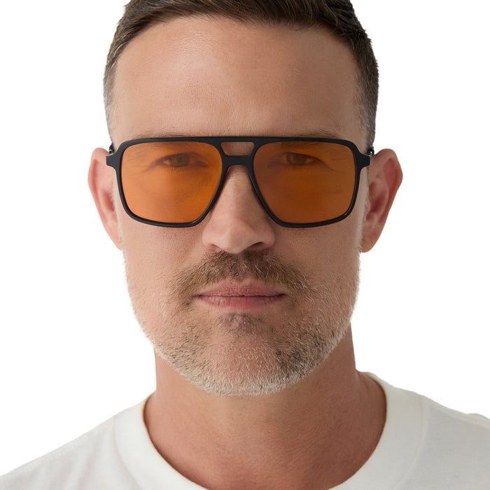 on model - male wearing star wars x diff eyewear fennec shand aviator sunglasses with a black frame and orange lenses front view