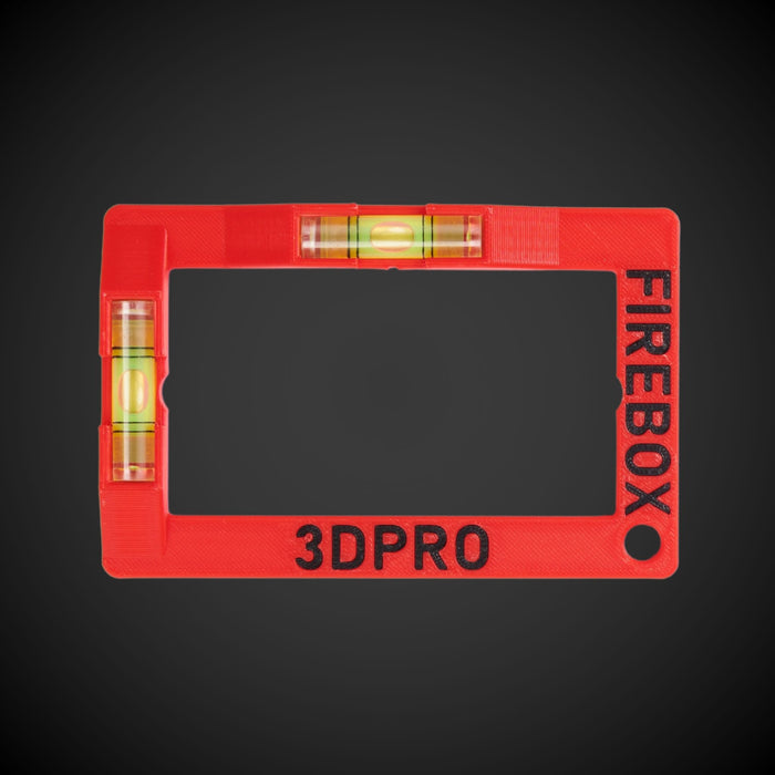 A red Firebox cut-out template with horizontal and vertical spirit levels and the text '3DPRO' on the frame.