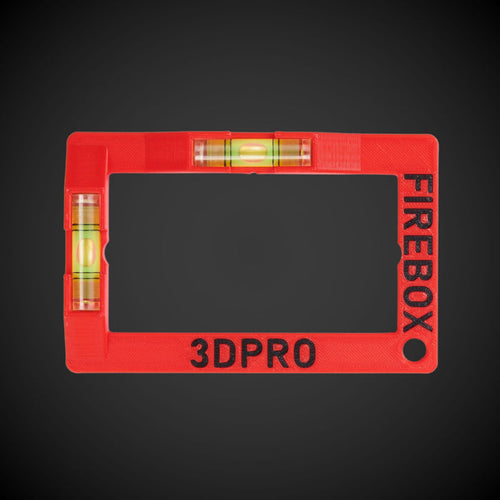 A red Firebox cut-out template with horizontal and vertical spirit levels and the text '3DPRO' on the frame.