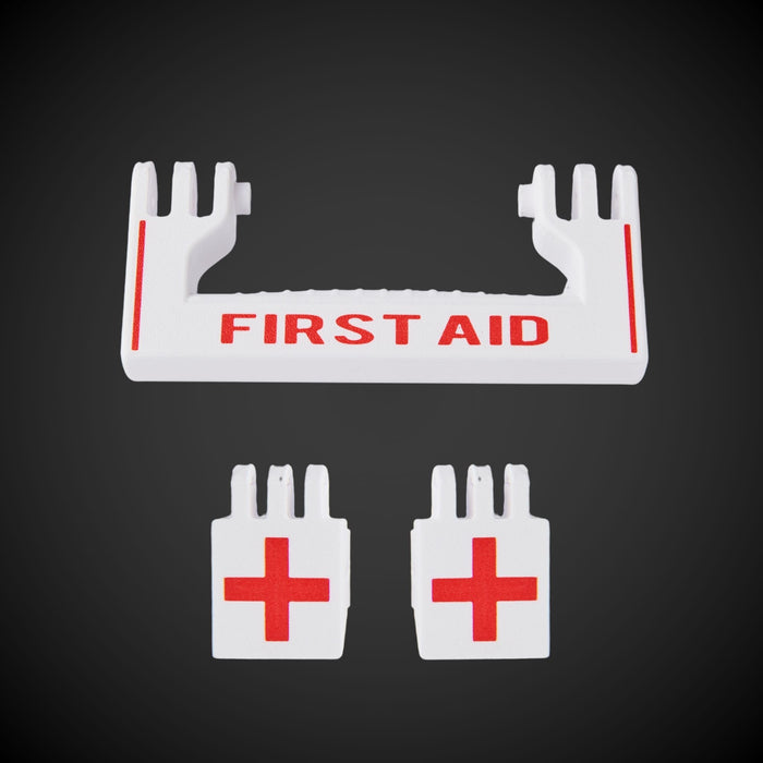 A white 'FIRST AID' M/P Standard Full Width and two white latches with red crosses for a first aid kit, against a black background.
