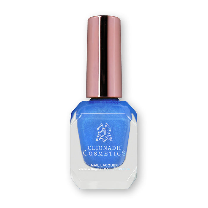 Bottle of nail polish containing Frigid Nail Lacquer on white background.