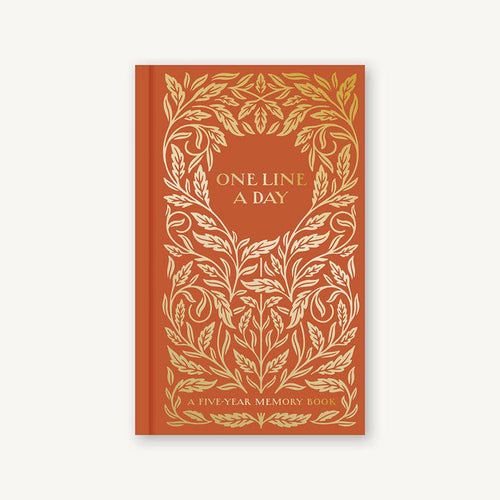 Book with decorative cover and 'One Line A Day' text on a white background