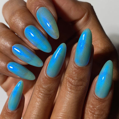 Close-up of nails painted with Ginto Nail Lacquer on medium skin tone.