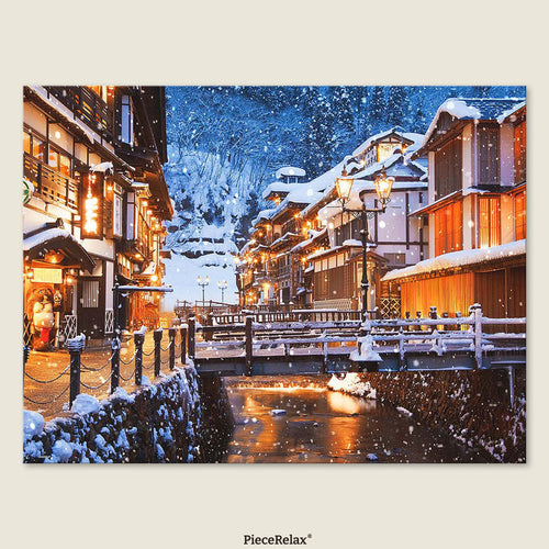 Winter in Ginzan Onsen: Steaming hot springs meet the silvery chill of snow — the perfect harmony of fire and ice.