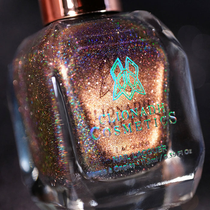 Angled, close-up of Graveyard Nail Lacquer bottle on a black background.