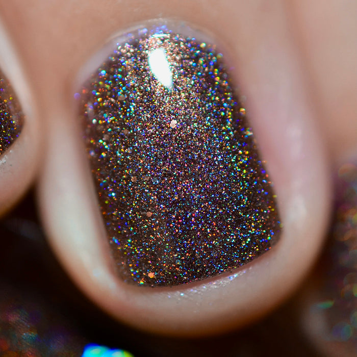 Close-up of one nail painted with Graveyard Nail Lacquer on fair skin tone.