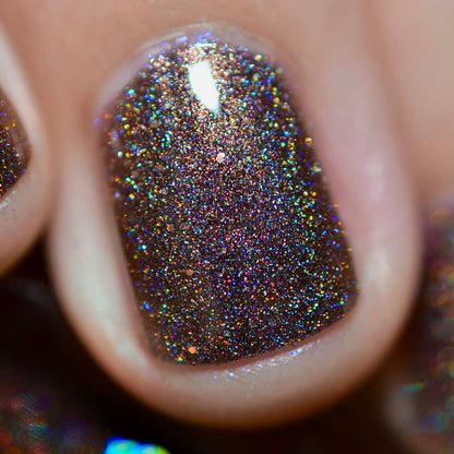 Close-up of one nail painted with Graveyard Nail Lacquer on fair skin tone.