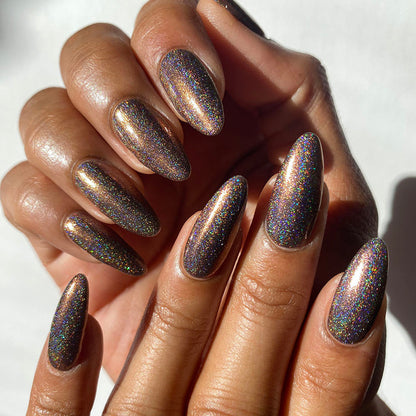 Nails painted with Graveyard Nail Lacquer on medium skin tone.