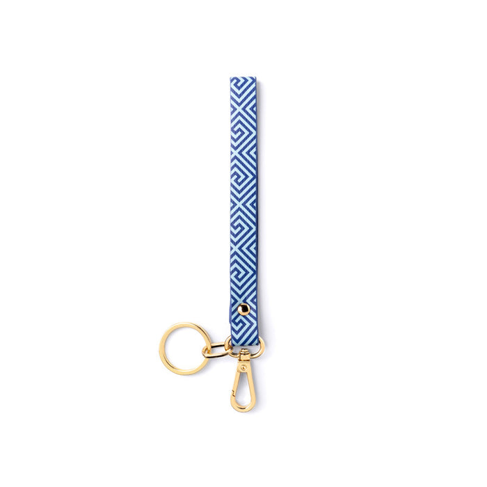 Keychain with blue geometric pattern and gold clasp on white background