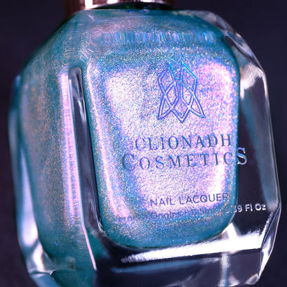 Close-up, angled shot of Holoberry Pie Nail Lacquer bottle on a black background.