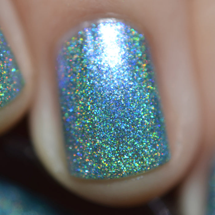 Close-up of one nail painted with Holoberry Pie Nail Lacquer on fair skin tone.