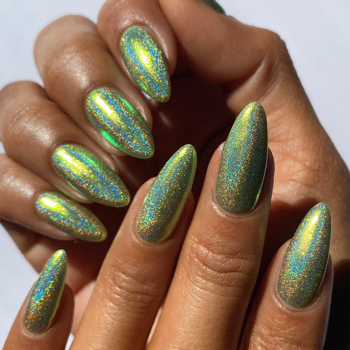 Close-up of nails painted with Holondaise Nail Lacquer on medium skin tone.