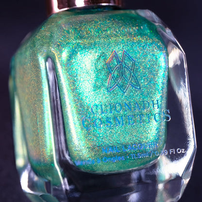 Close-up, angled shot of Holopeño Nail Lacquer bottle on a black background.