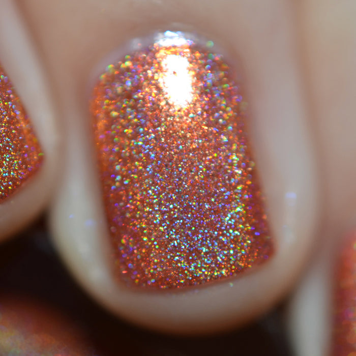 Close-up of one nail painted with Holoritos Nail Lacquer on fair skin tone.