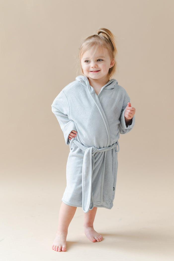 Young girl posing wearing the Hooded Bath Robe in Storm