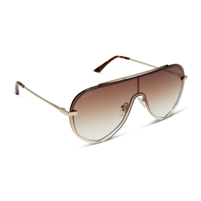 diff eyewear featuring the imani shield sunglasses with a gold frame and brown gradient lenses angled view