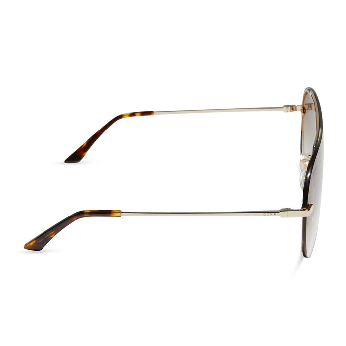 diff eyewear featuring the imani shield sunglasses with a gold frame and brown gradient lenses side view