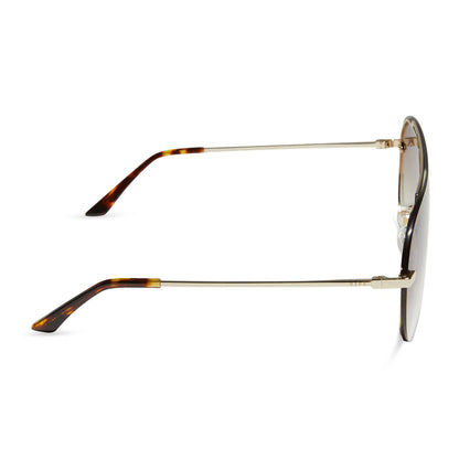 diff eyewear featuring the imani shield sunglasses with a gold frame and brown gradient lenses side view