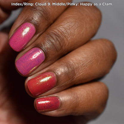 Close-up of nails painted with Cloud 9 and Happy as a Clam Nail Lacquers over a pink base on deep skin tone.
