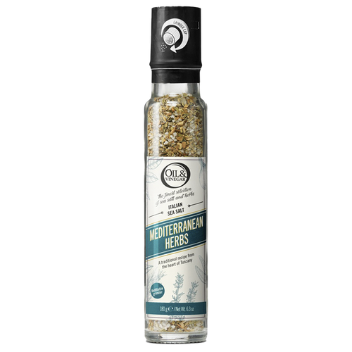 A clear glass bottle with a black lid containing ground Italian sea salt with Mediterranean herbs visible through the bottle, labeled 'MEDITERRANEAN HERBS'.