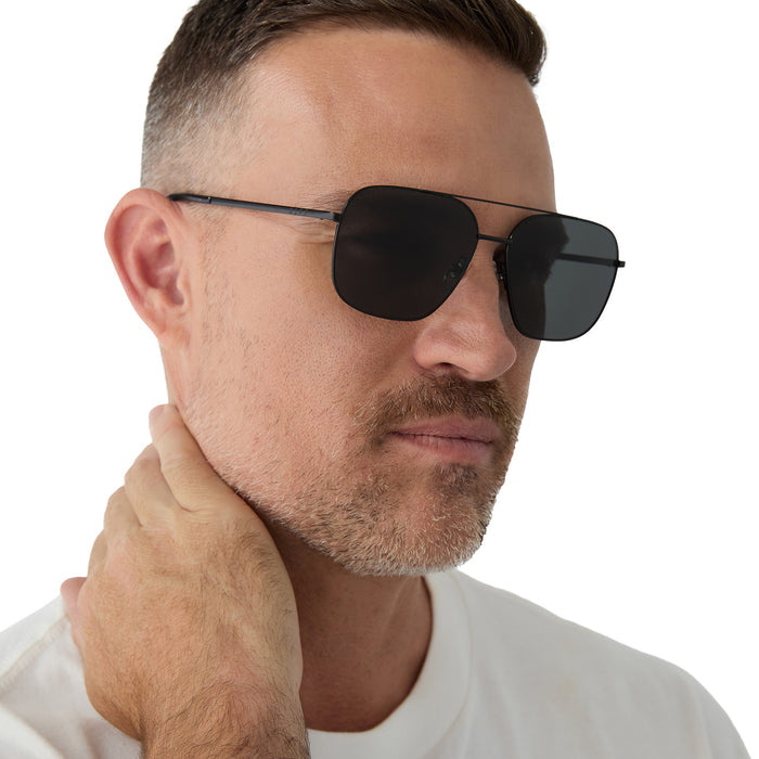 on model - male wearing diff eyewear jonas aviatorsunglasses with a black frame and grey polarized lenses angled view