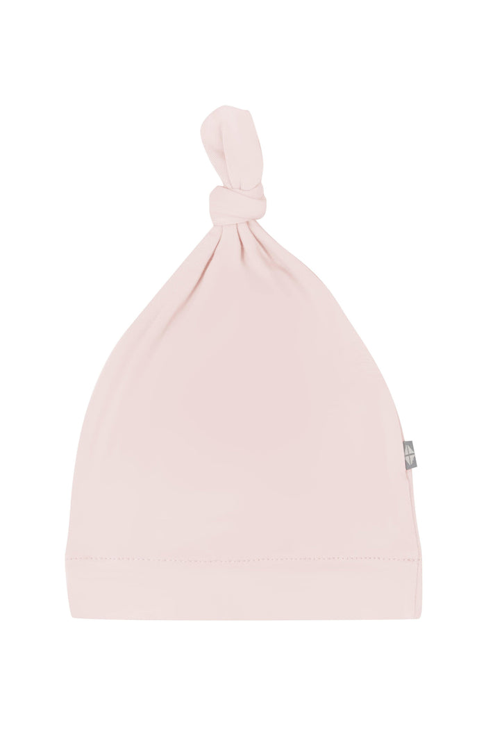 Flat lay of Kyte Baby Knotted Cap in Blush