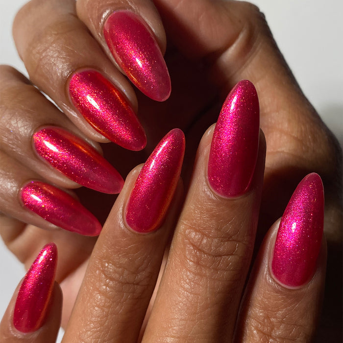 Close-up of nails painted with La Vie En Rose Nail Lacquer on medium skin tone.
