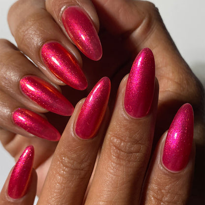 Close-up of nails painted with La Vie En Rose Nail Lacquer on medium skin tone.