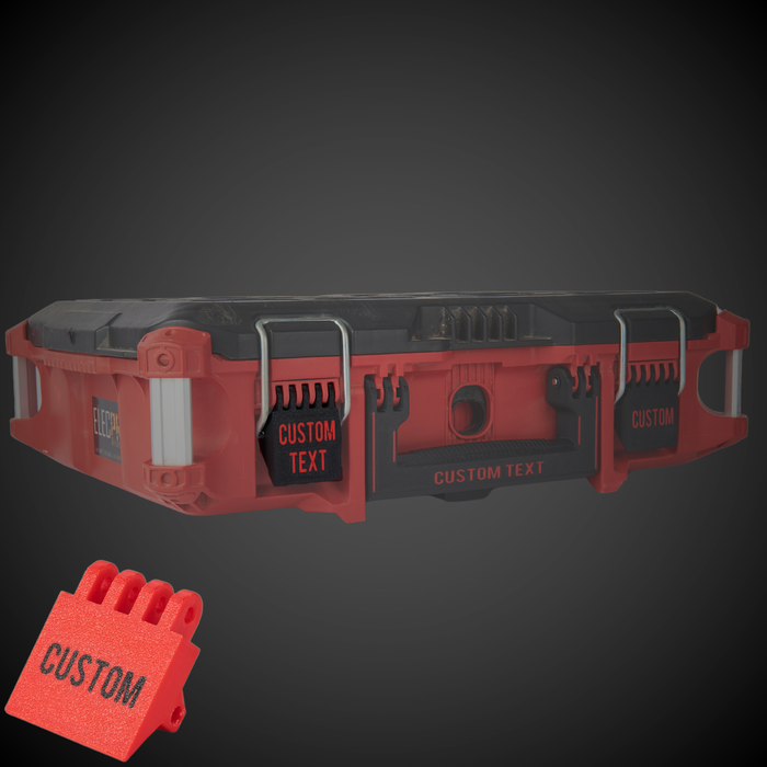 A custom red latch for a Milwaukee Packout rolling box with the text 'CUSTOM TEXT' displayed on the side, against a black background.