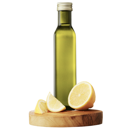 A bottle of Lemon Extra Virgin Olive Oil with a slice of lemon in front of it, placed on a wooden board.