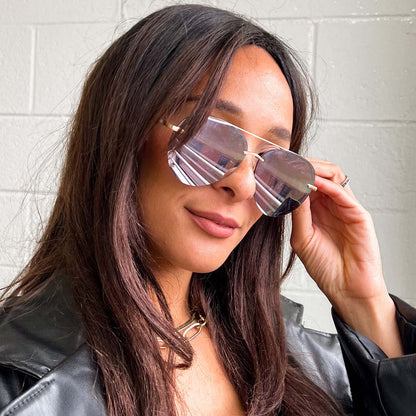 UGC - customer content - female wearing lenox aviator sunglasses with brushed gold frame with cherry blossom mirror sunglasses 2