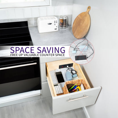 In-drawer charging station with AC outlet and USB ports.