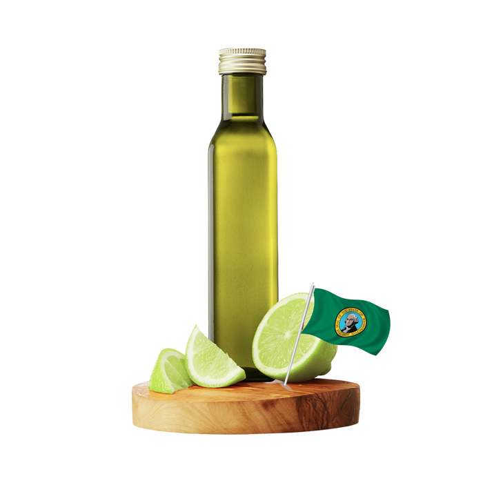 A tall olive-green glass bottle with a silver cap stands on a round wooden board with several green lime wedges and a small Washington flag.