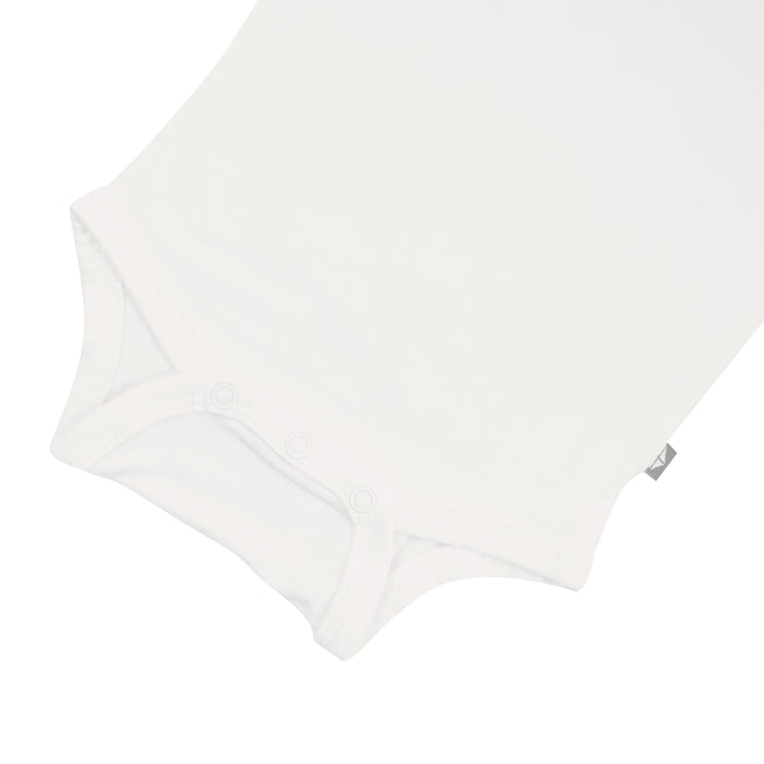 Snap bottom of Kyte Baby Long Sleeve Bodysuit in Cloud