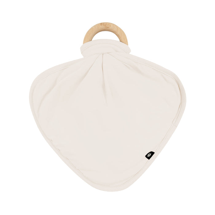 Flat lay of Kyte Baby Lovey in Oat with Removable Wooden Teething Ring
