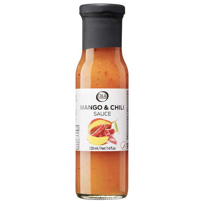 A bottle of Mango & Chili Sauce with visible pieces of red chili and mango.