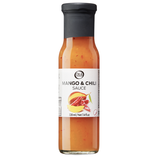 A bottle of Mango & Chili Sauce with visible pieces of red chili and mango.