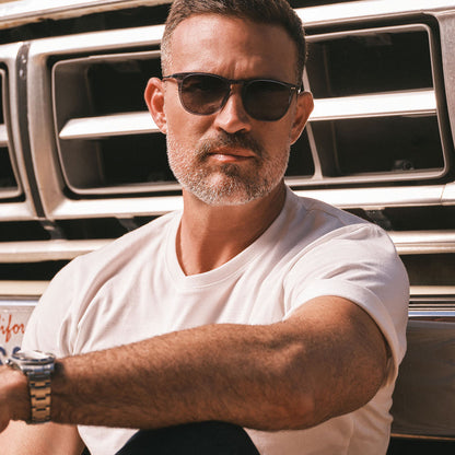 lifestyle - male wearing diff eyewear maxwell square sunglasses with a blue night sky frame and grey gradient polarized lens front view